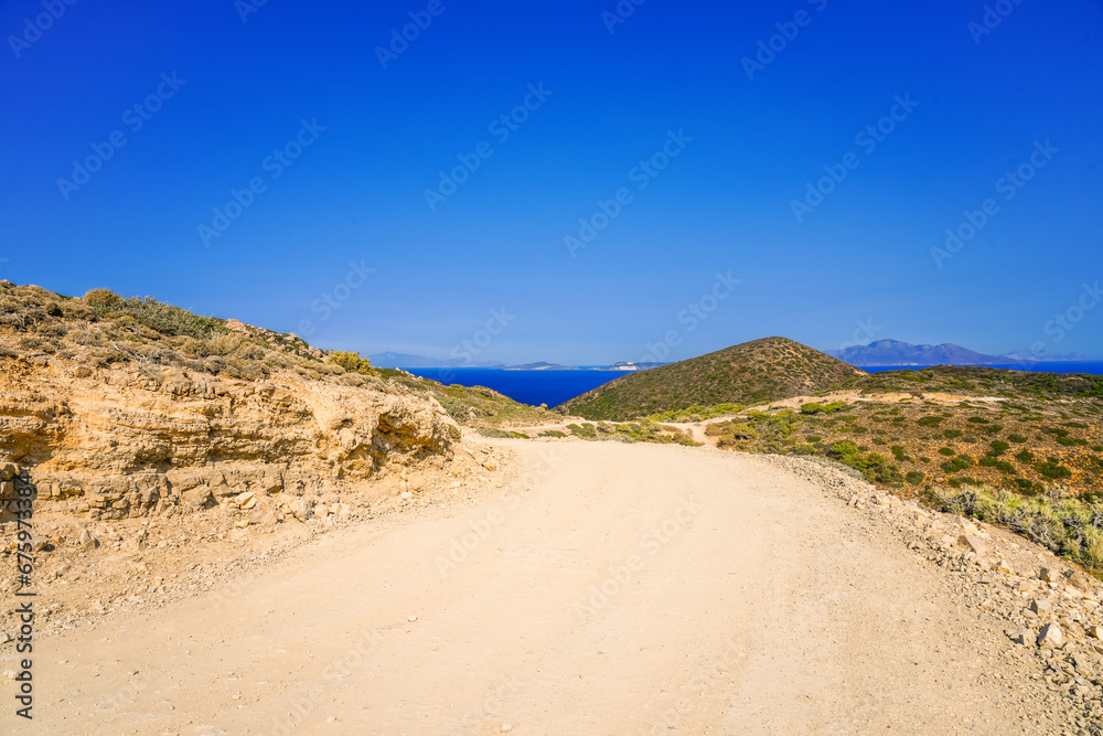 View of the landscape and the Mediterranean Sea from a mountain on the Greek island of Kos.	