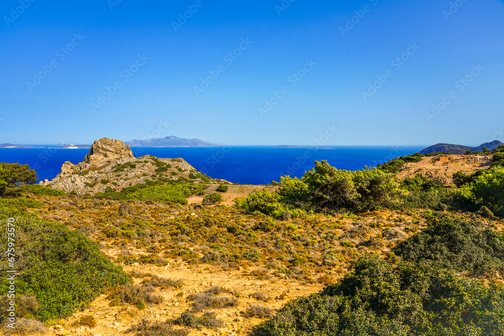 View of the landscape and the Mediterranean Sea from a mountain on the Greek island of Kos. View of the landscape and the Mediterranean Sea from a mountain on the Greek island of Kos.