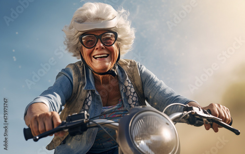 An elderly woman with a joyful look speeds by on her motorbike