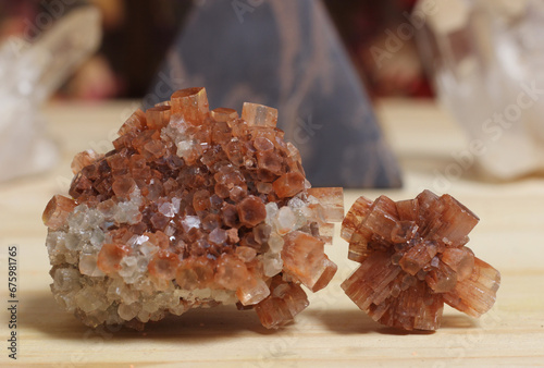 Aragonite Carbonate Crystals With Pyramid in Background