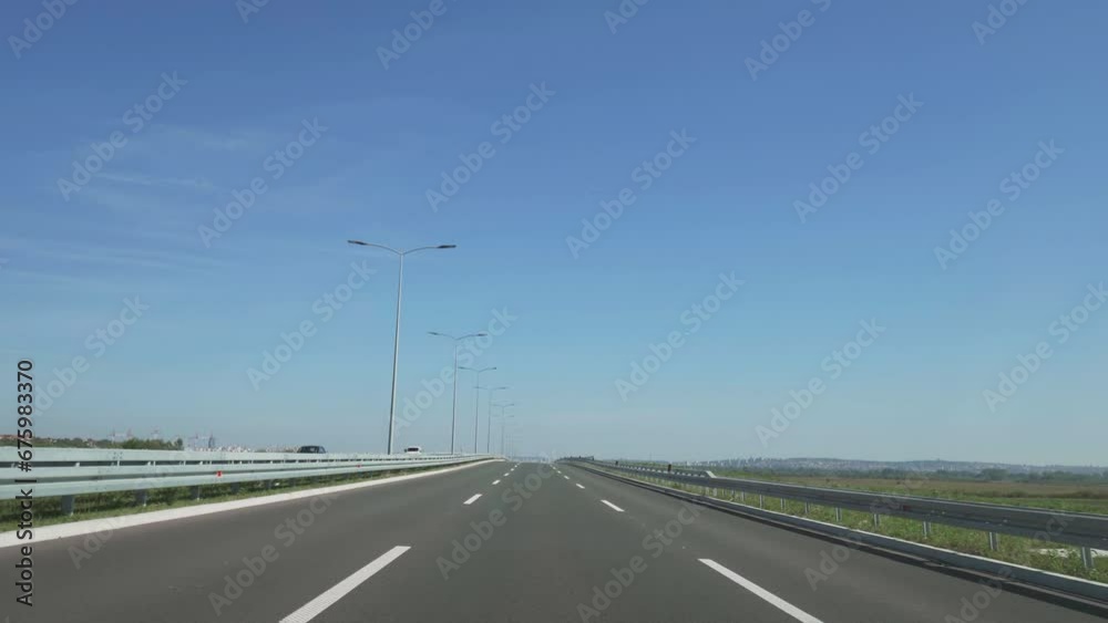 Windscreen front view POV of driving on straight line highway
