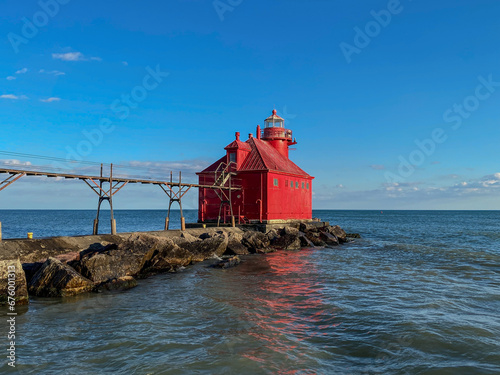Red Lighthouse in the clear sky, Lake Michigan, Lake side, Pier