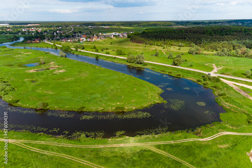 The bend of the oxbow lake Ogublyanka from the air, green natural landscape photo