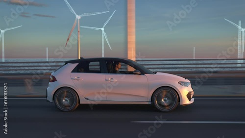 Offshore wind turbines building up behind a generic electric car driving along bridge or coastal highway into the sunset. Expansion of renewable energies. Wind farm construction. Green energy concept photo