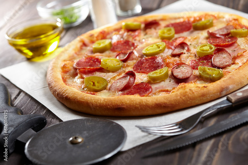 tasty pizza on the wooden background