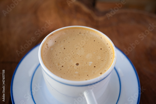 Close-Up and Focus on the Foam of a Freshly Brewed Coffee. With Copy Space