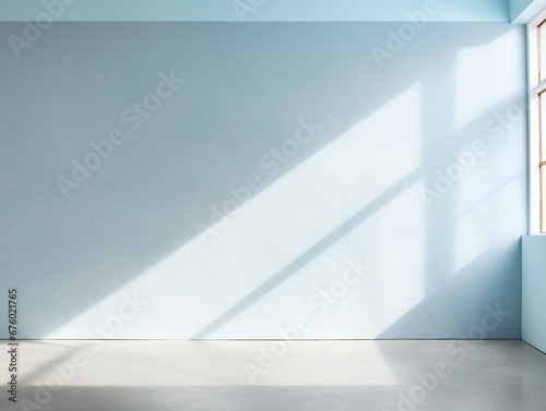 empty room blue plaster wall  empty light cream room  with glare from the window. Interior background for the presentation