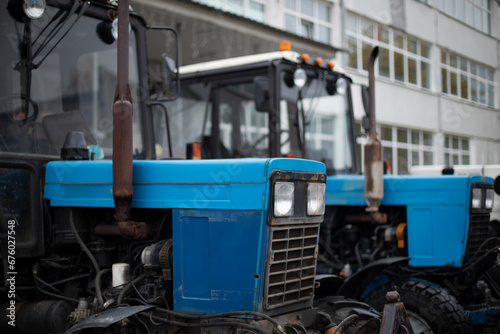 Blue tractor. Industrial engineering. Agricultural transport.