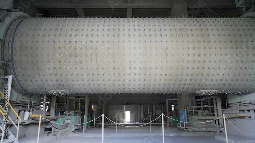 Ball mill in the cement industry. Industrial enterprise for cement processing. Territory of the cement plant.