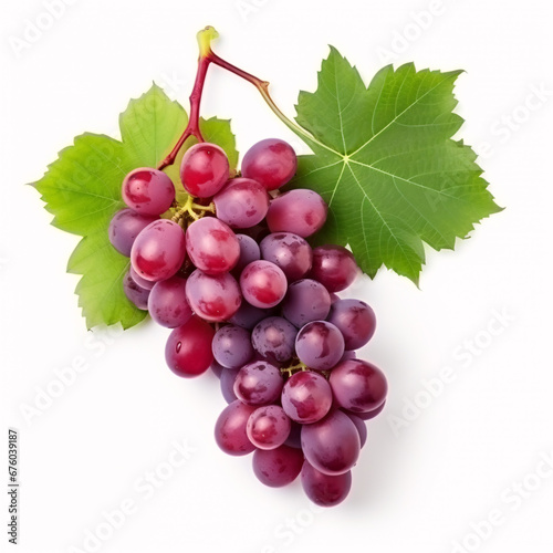 Isolated top-view of halved red grapes with verdant foliage on a plain white backdrop.