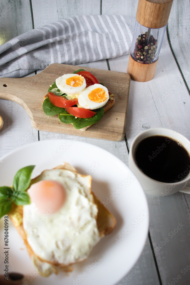 Healthy breakfast with egg, tomatoes and salad. on a wooden table. food