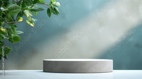 white podium with green leaves on blue wall background 