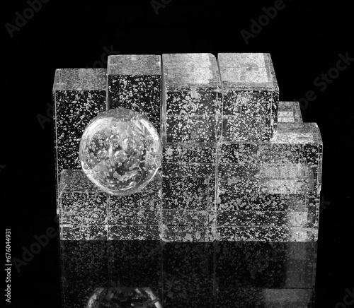 Fototapeta Naklejka Na Ścianę i Meble -  transparent glass geometric shapes and cubes on a black background