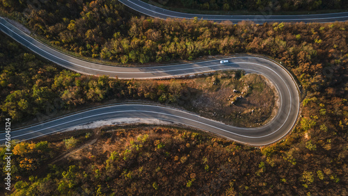 car vehicle drive on Tresibaba mountain range nature aerial view in autumn day near Knjazevac Serbia top down photo