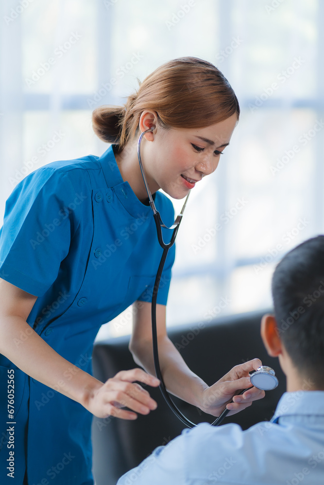 Doctor and patient sitting and talking at medical examination at hospital office, close-up. Therapist filling up medication history records. Medicine and healthcare concept. Doctor and patient sitting and talking at medical examination at hospital office, close-up. Therapist filling up medication history records. Medicine and healthcare concept.