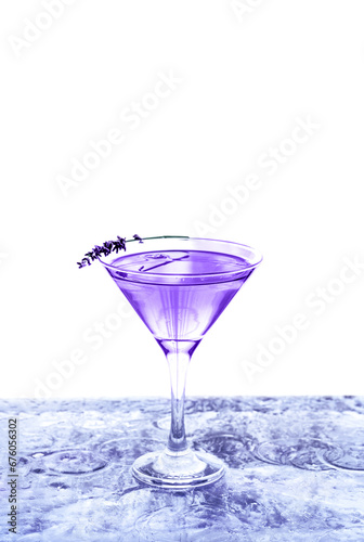 Modern transparent cocktail adorned with lavender standing on ice bar. Isolated white background.