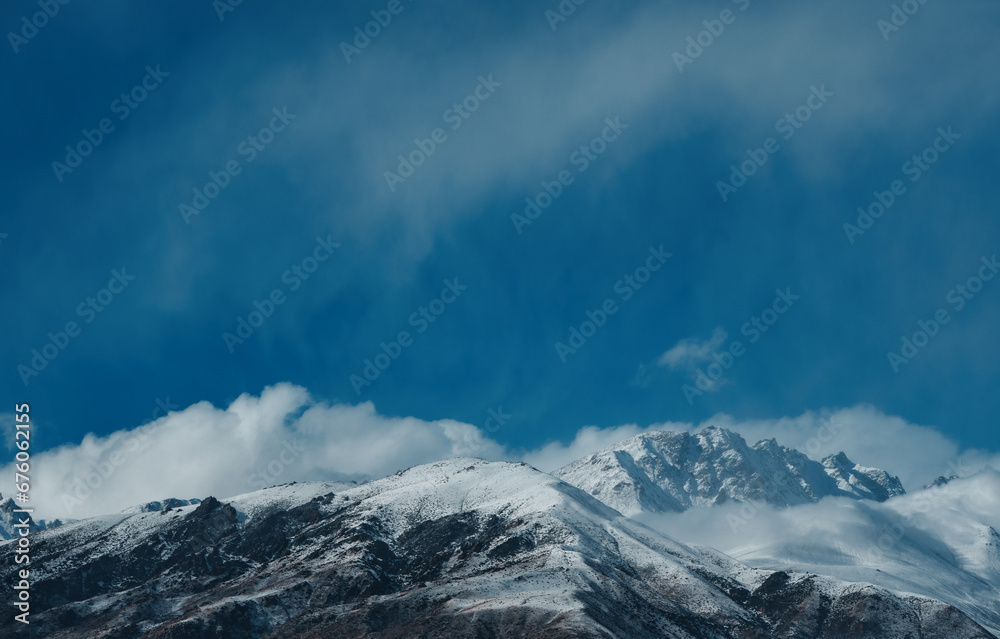 Picturesque mountain landscape with snowy peaks