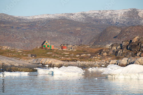 Panoramic view of Disko Bay with icebergs from the village Oqaatsut in the early morning near Ilulissat. The source of these icebergs is the Jakobshavn glacier, West Greenland photo