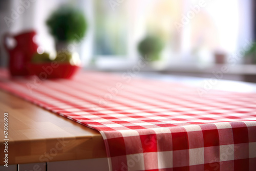 White and red checkered tablecloth on kitchen table photo