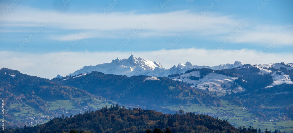 Distant view of the iconic Säntis Peak in the swiss alps from shores of the upper Zurich Lake (Obersee), Rapperswil, St. Gallen, Switzerland