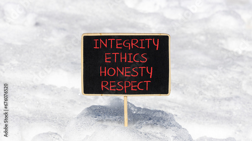 Integrity ethics honesty respect symbol. Concept word Integrity Ethics Honesty Respect on beautiful blackboard. Beautiful white snow background. Business integrity ethics honesty respect concept.