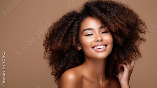 Beautiful black woman Beauty portrait of african american woman with clean healthy skin on beige background Smiling beautiful afro
