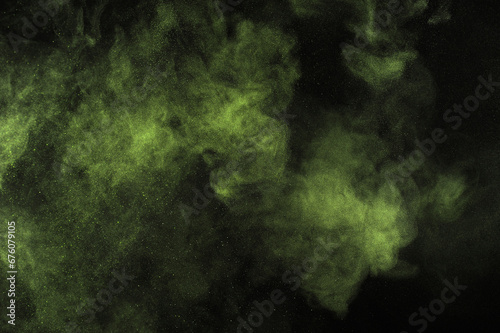 Light green powder explosion on black background. Citron color cloud. Lime dust explode. Freeze motion paint Holi.