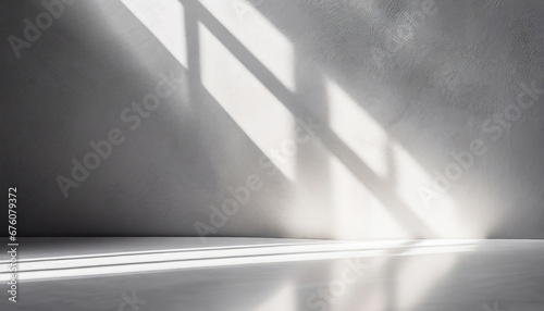 minimal abstract light gray background for product presentation shadow and light from windows on plaster wall