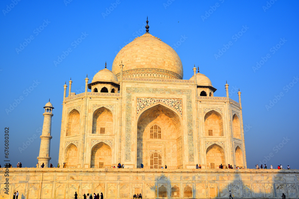 View of the Taj Mahal at sunrise is an ivory-white marble mausoleum on the right bank of the river Yamuna in Agra 
