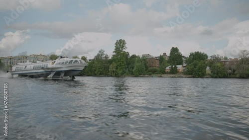 St. Petersburg, Russia - June 2023: Luxury tourist speedboat Raketa rides tourists along the Neva Canal photo