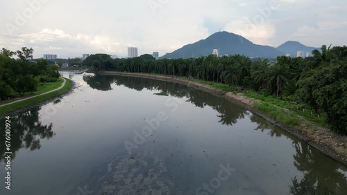 Aerial view dark muddy river Sungai Juru photo