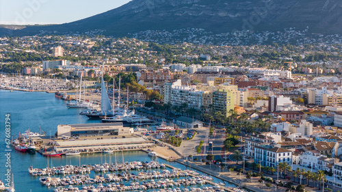 Aerial drone view of the coastal town with a harbour named Denia in Spain