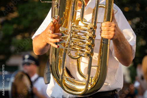 Military musicians with baritone horn in hand photo