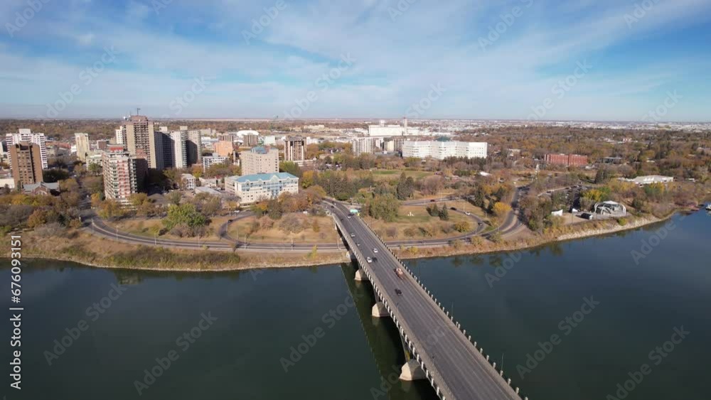 Aerial video of Saskatoon's downtown central business district, SK, Canada. Skyline view reveals bustling urban life, commercial buildings, and roads. Ideal for business concepts. Aerial video of Saskatoon's downtown central business district, SK, Canada. Skyline view reveals bustling urban life, commercial buildings, and roads. Ideal for business concepts.