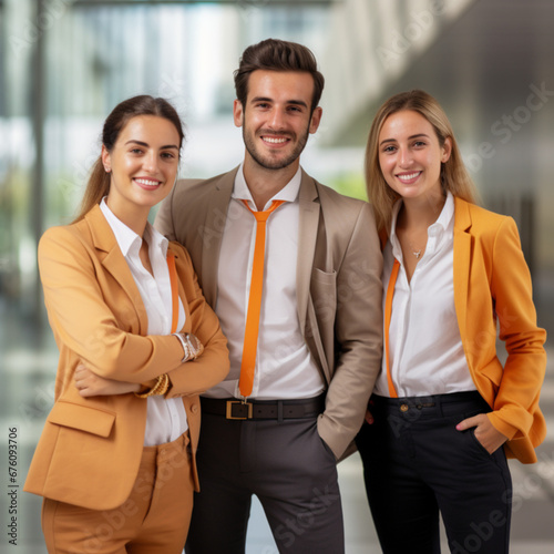 photograph of a group of ONLY THREE PEOPLE 28-year-old people, who are from the management area, smiling, the background must be that of a business office, with clothing in orange tones