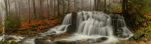 Ponikly waterfall with flood water after night rain in autumn morning