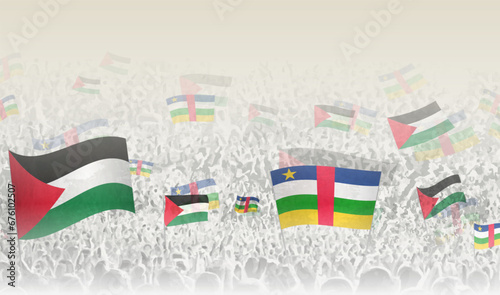 Palestine and Central African Republic flags in a crowd of cheering people.