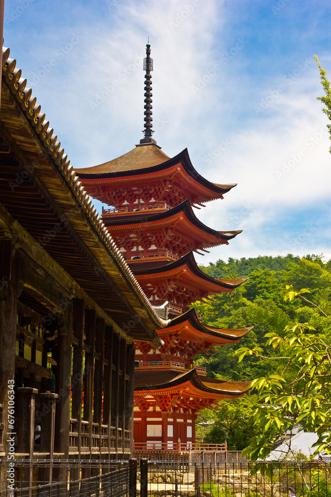 wood pagoda in front of mount fuji
