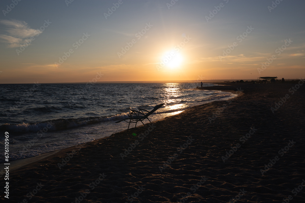 beautiful sunset on a sandy beach near the ocean. great background for design