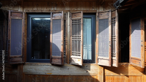 The old wooden house with the white wall and black eaves located in the old village on the south of the China