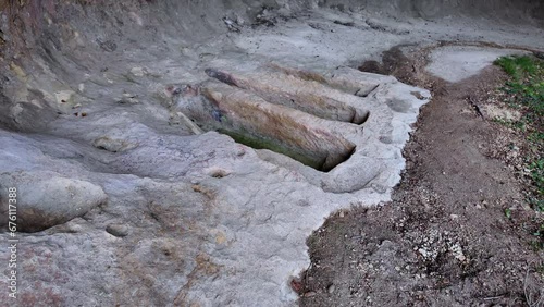 Anthropomorphic tombs in the hermitical cave of Santiago in Pinedo. Medieval cave that was inhabited by hermits. Valdegovia Valley. Alava. Basque Country. Spain. Europe photo