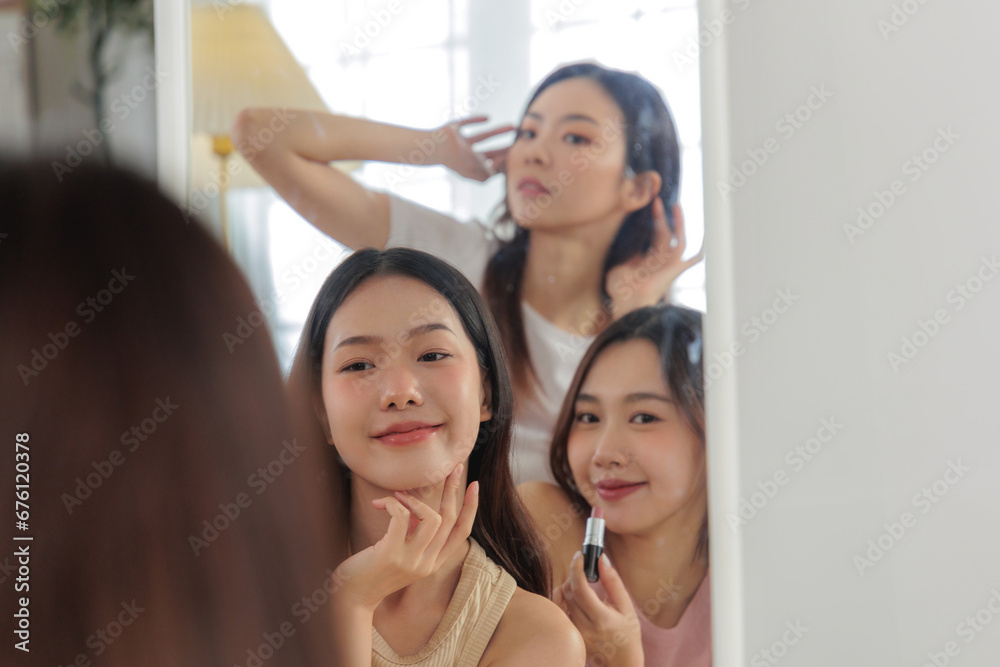 Fototapeta premium Asian woman friends share a skincare routine