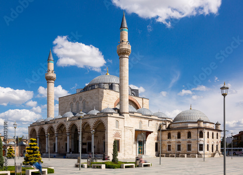 Spring view of Konya central square with Selimiye medieval Ottoman mosque with two minarets on sunny day, Central Anatolia, Turkey.