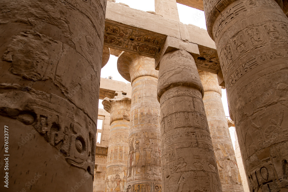 ancient Egyptian hieroglyphs on massive columns of hippostyle hall in karnak temple in luxor, egypt ancient Egyptian hieroglyphs on massive columns of hippostyle hall in karnak temple in luxor, egypt