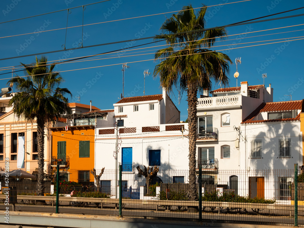 Street view of Catalan city of Vilassar de Mar on warm sunny winter day, Maresme, Spain.