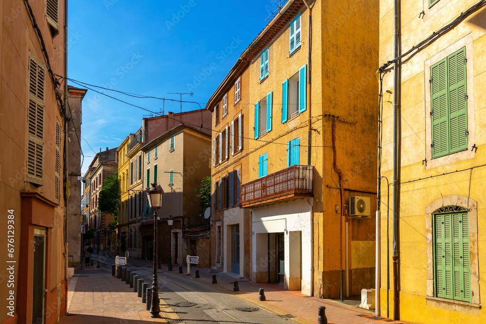 View of typical narrow streets in small medieval French township of Brignoles on sunny autumn day, Var department.