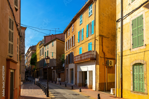 Fototapeta Naklejka Na Ścianę i Meble -  View of typical narrow streets in small medieval French township of Brignoles on sunny autumn day, Var department.