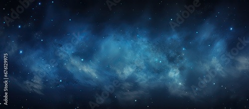 The abstract background with a texture reminiscent of the night sky in nature creates a mesmerizing spectacle of space and stars combining black and blue tones It is a perfect wallpaper for photo