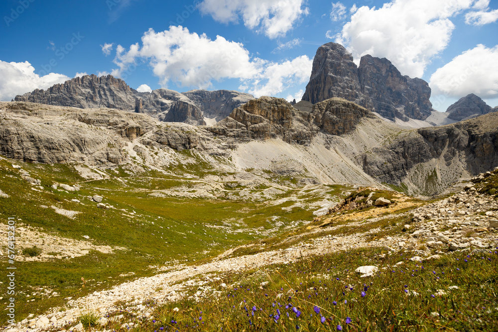 Amazing views of the picturesque high Dolomites mountains, lawns and summer forest