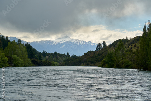 Dramatic clouds over Clutha River with Roy's Peak in the background, New Zealand
